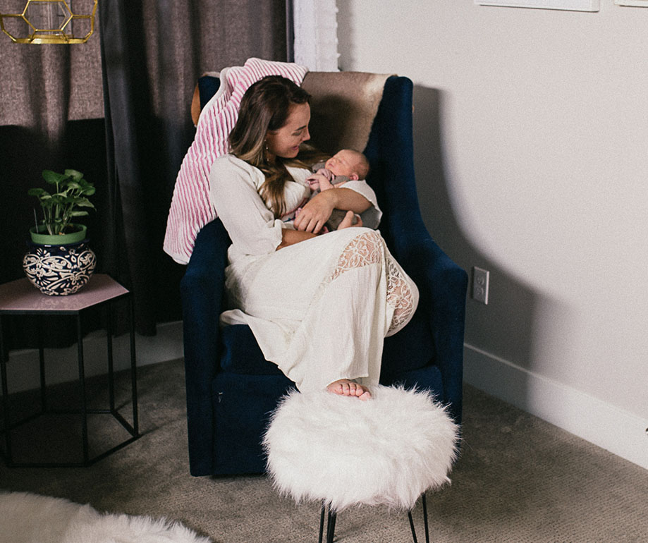 Postpartum doula supporting a new mom